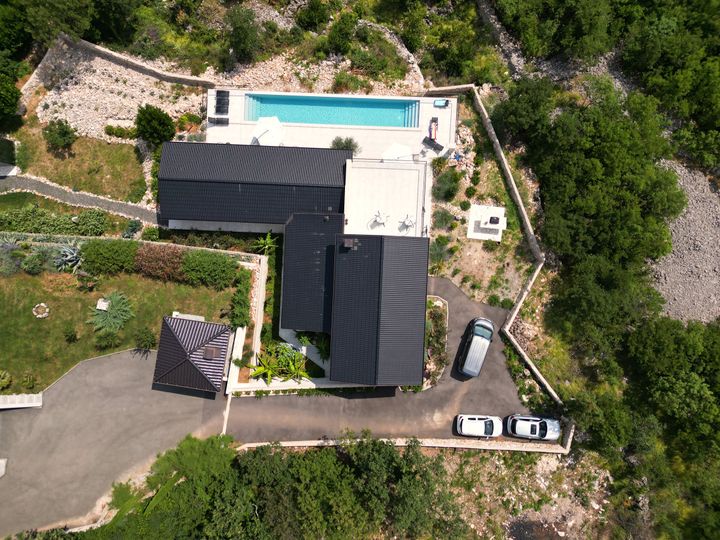 drone top-down of villa, pool and grounds