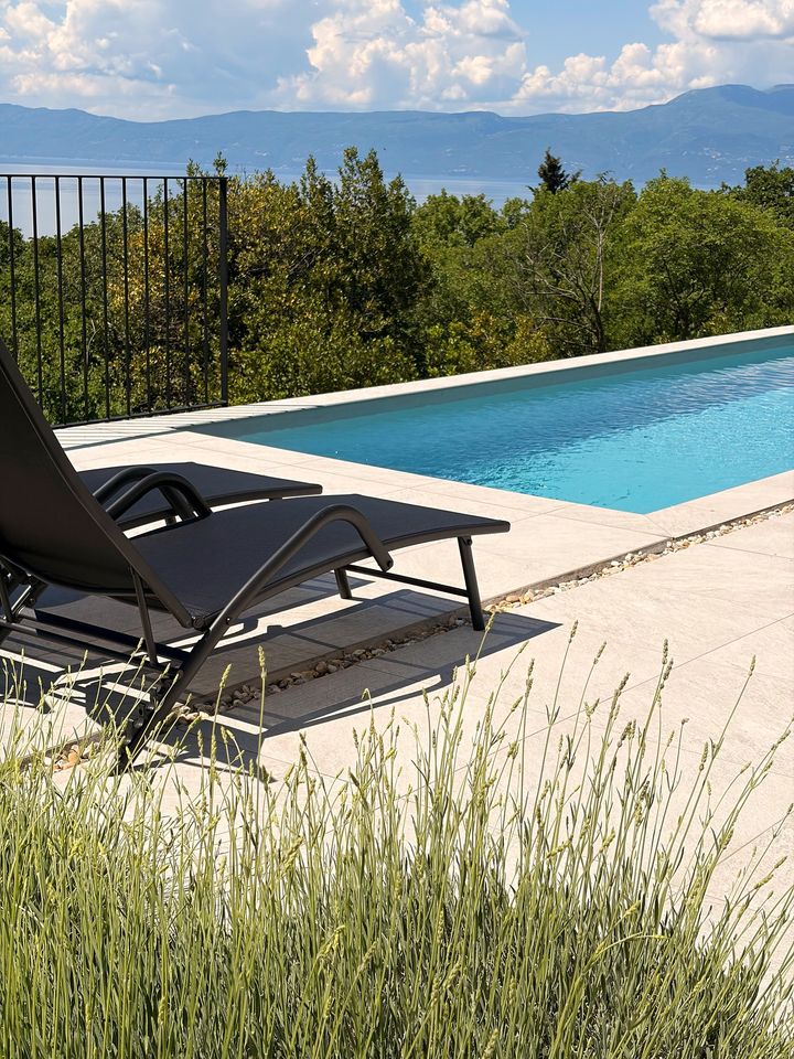 poolside loungers, lavender, distant sea and mountains