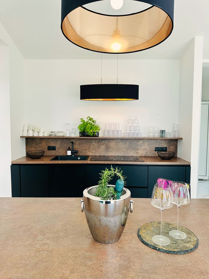 wet bar with champagne bucket and wine glasses